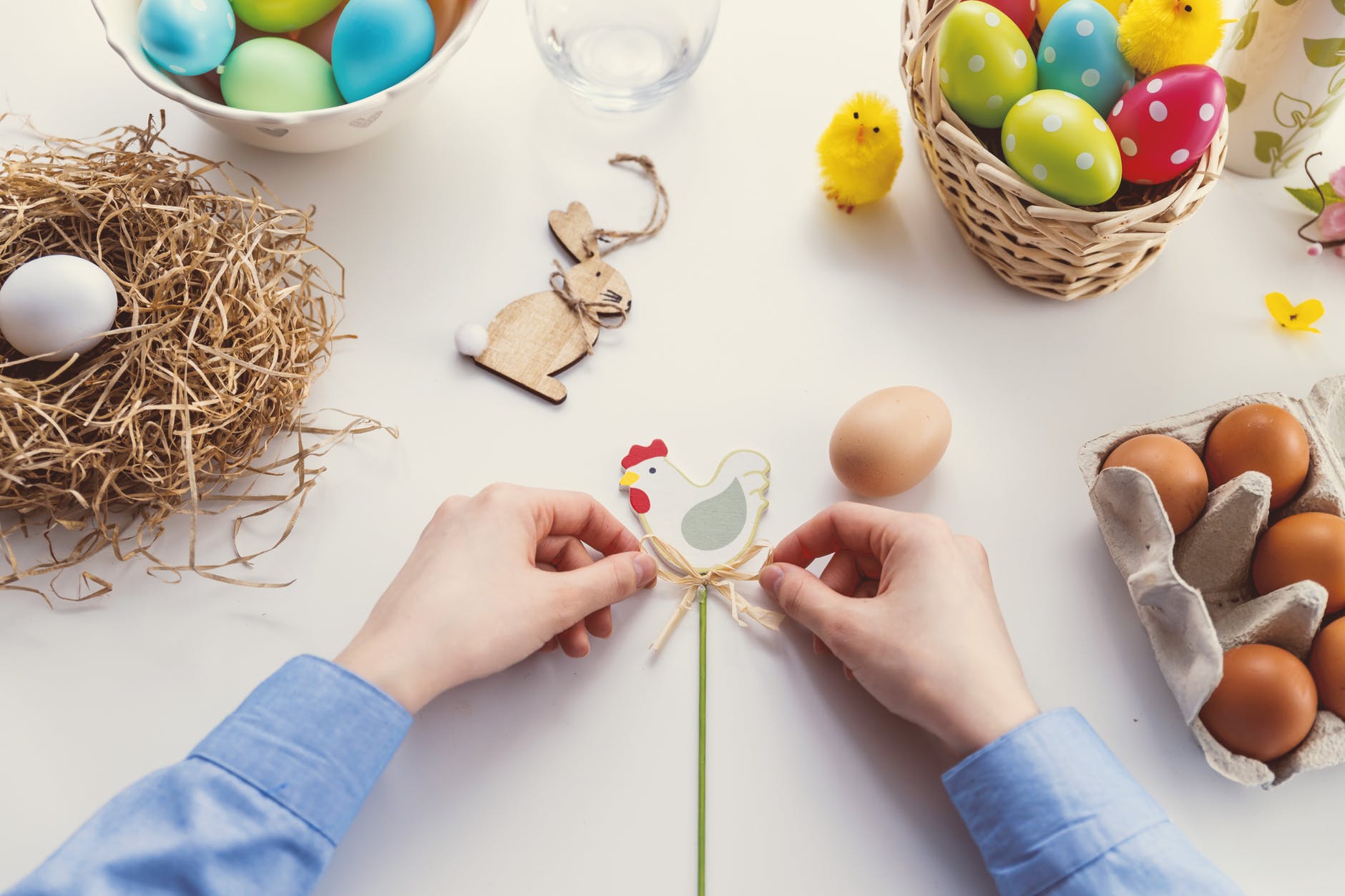 person tying knot on chicken decor