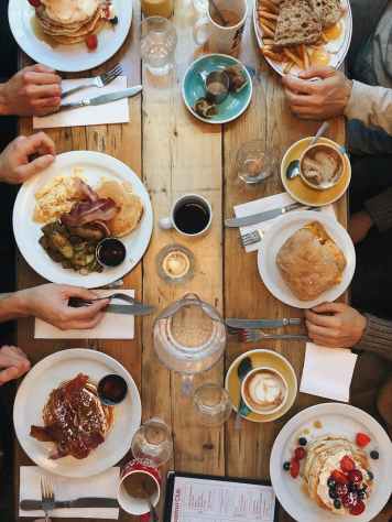 assorted variety of foods on plates on dining table